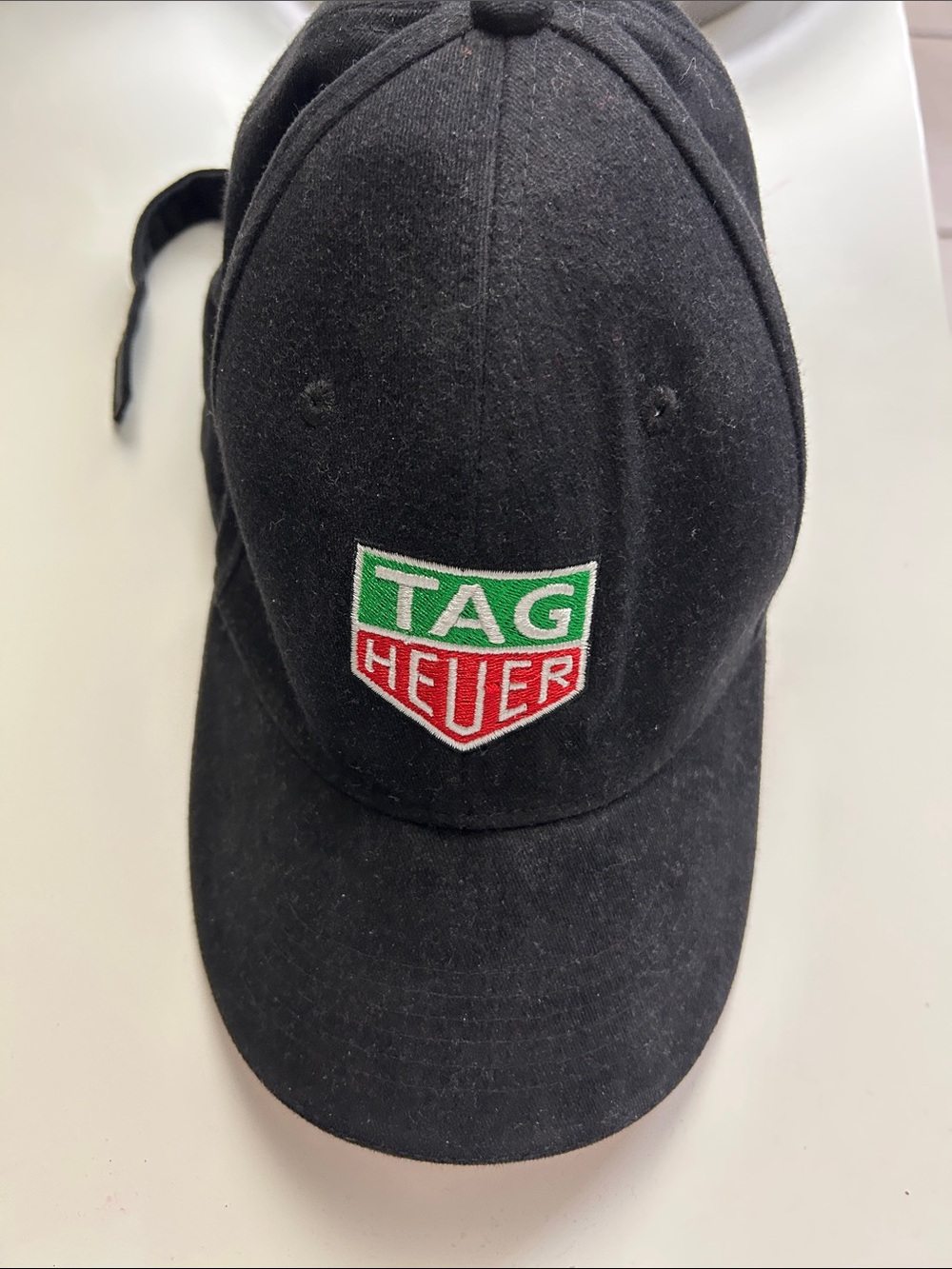 Tag Heuer Black Cap with Green and Red Shield Logo. Brand new never worn.